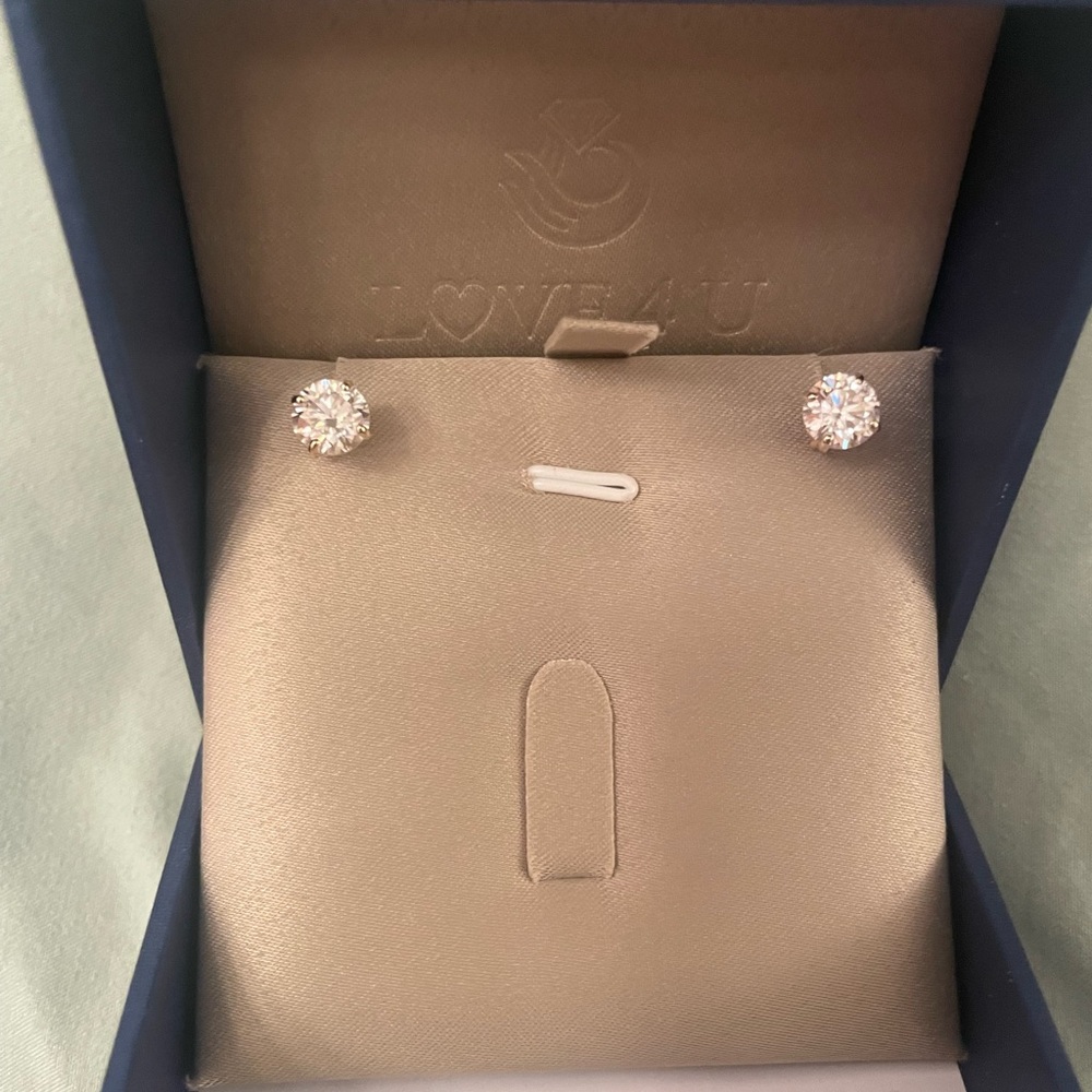 6.5mm moissanite studs with 14k solid gold.